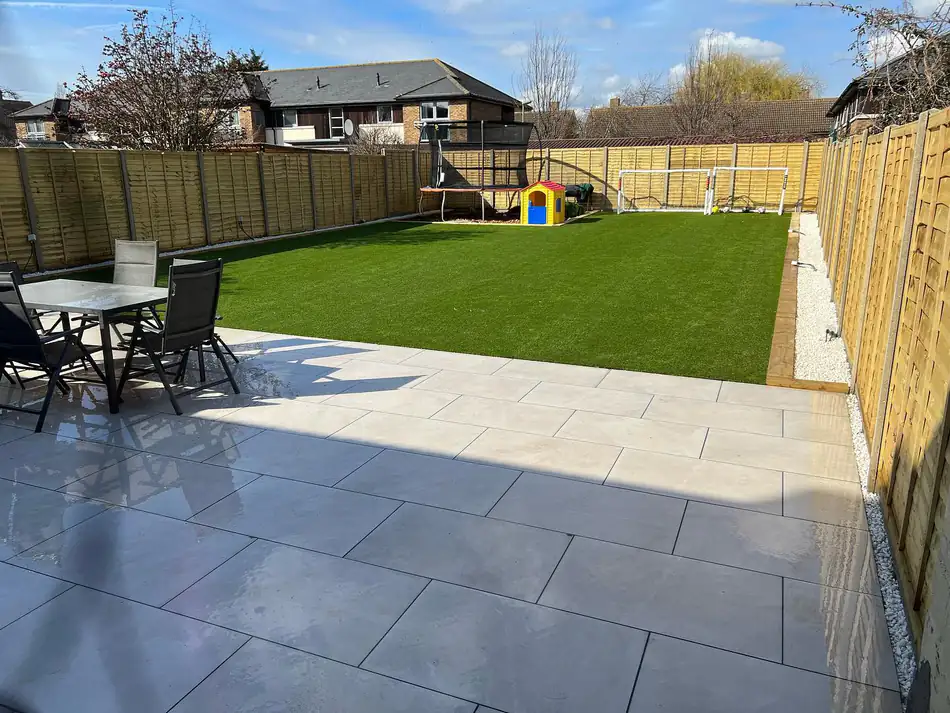 A completed TBL Fencing project — fence run, patio and lawn