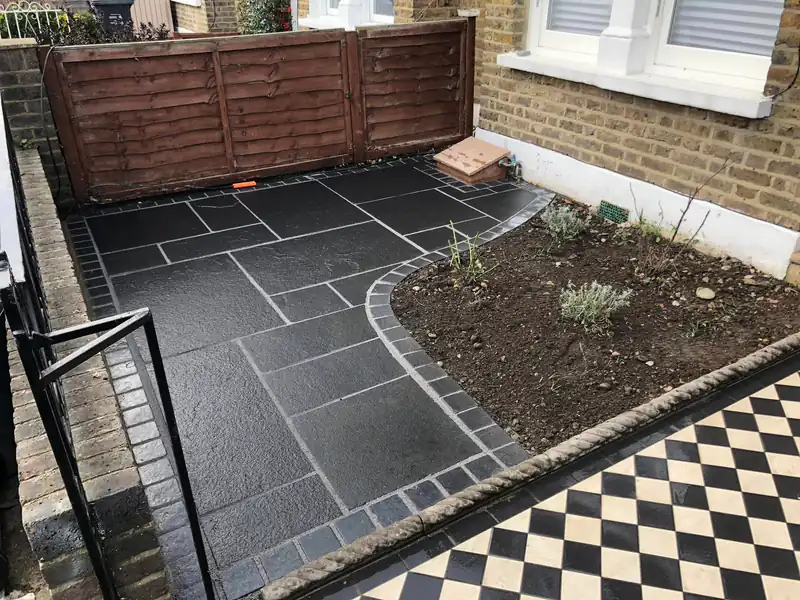 Grey paving patio with a chequerboard path