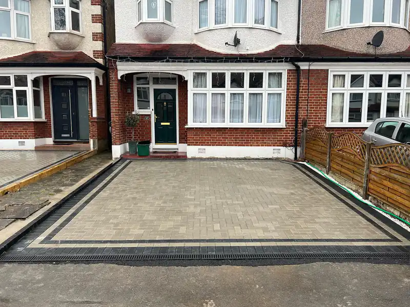 Block-paved front driveway with fencing and trellis alongside