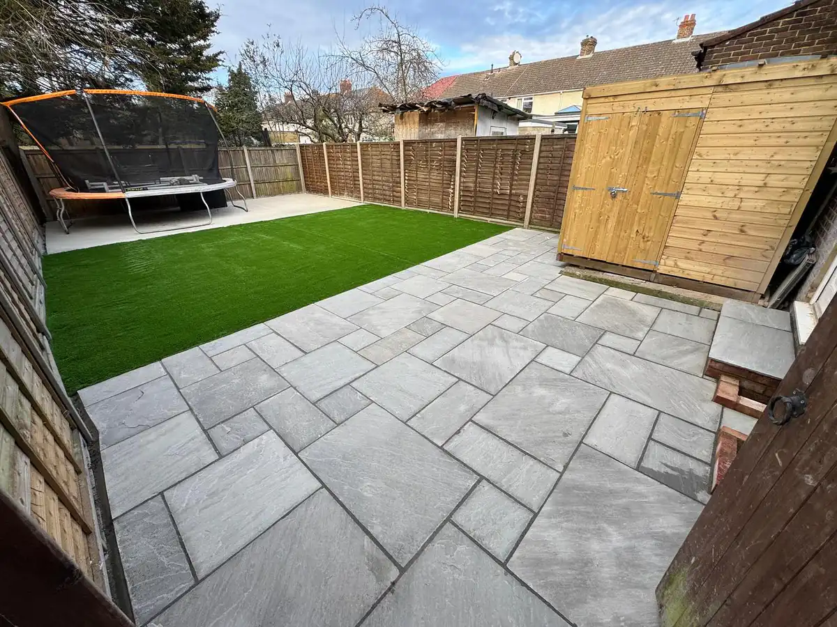 A completed TBL Fencing garden project in Morden — panel fencing, patio and lawn